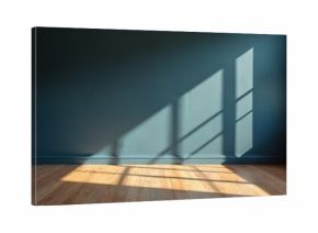 Interior of an empty room with dark teal walls and wooden floors. Sunlight streams through the window casting geometric shadows on the wall and floor, creating a tranquil atmosphere.