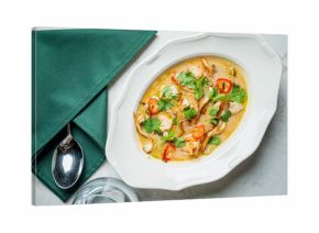 A rich, flavorful soup with shrimp, herbs, and chili sits invitingly, ready to be enjoyed