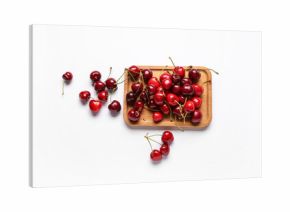 Wooden board with sweet cherries on white background