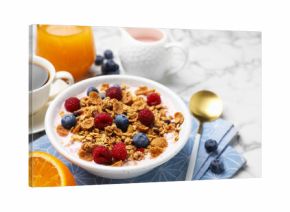 Tasty breakfast. Granola with yogurt and fruits served on white marble table, closeup