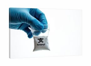 Blue gloved hand holds clear plastic bag with white powder labeled fentanyl and skull hazard symbol. This drug is a dangerous opioid linked to overdose deaths.