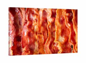 Texture of fried bacon rashers as background, closeup