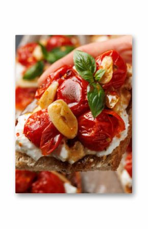 Cottage cheese and roasted tomatoes sourdough bread toast on a wooden board.