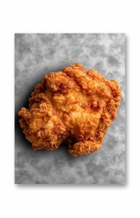 Crispy fried chicken breast on grey background