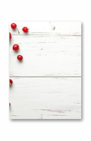 organic cherries on a white wooden table background