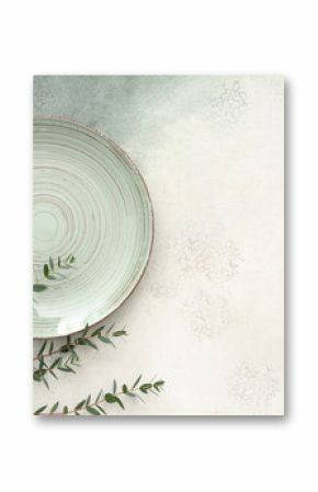 Stylish table setting with plate and plant branches on grunge background