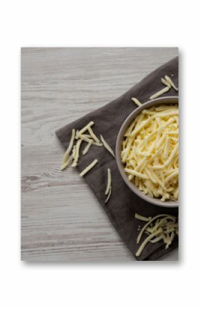 Shredded Mozzarella Cheese in a Bowl, top view. Copy space.