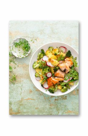 Salmon and potato salad with asparagus, broccoli and radish, top view