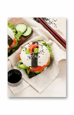 Hybrid modern food. Sushi burger with salmon, white rice, avocado, cucumber.