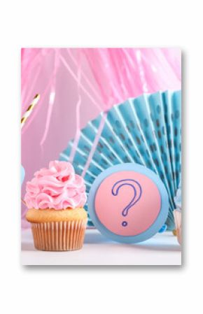 Delicious cupcakes with question mark and decorations on table against white background. Gender reveal party concept