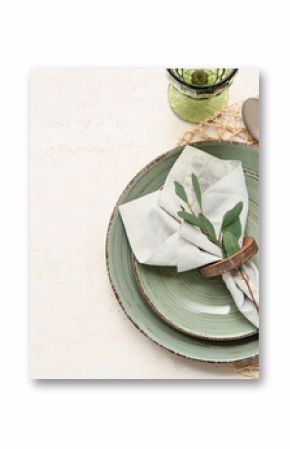 Beautiful table setting with leaves on white background