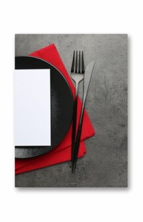 Empty menu, plate, cutlery and napkin on grey table, top view. Mockup for design