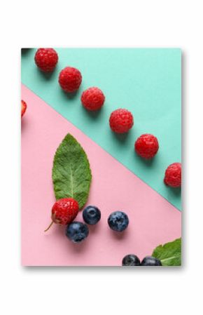 Fresh raspberries, blueberries and strawberries on colorful background