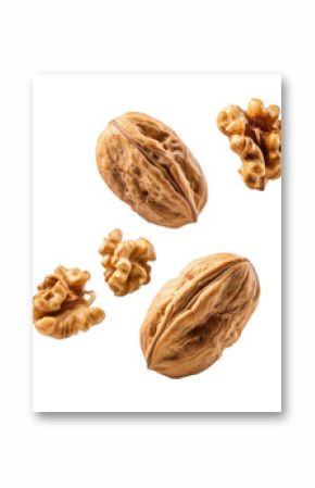 Several walnuts with hard shells are frozen in mid air, showcasing their texture and natural beauty