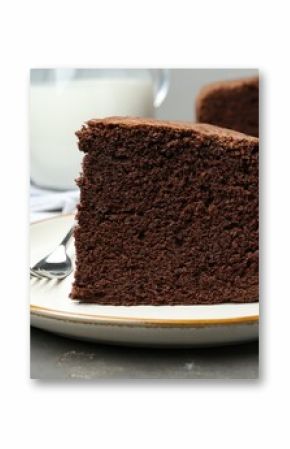 Piece of tasty chocolate sponge cake served on grey table, closeup