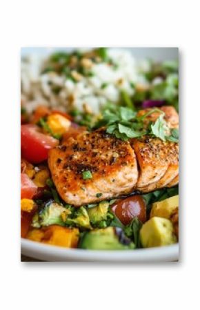 Delicious grilled salmon with fresh vegetables and rice served in a colorful bowl at a cozy restaurant