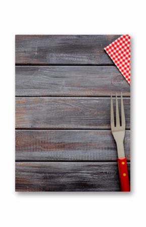 Set with barbecue utensils and equipment with red picnic napkin. Stainless steel tools. Top view