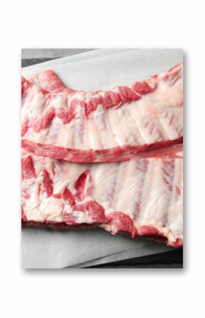 Raw pork ribs on grey table, top view