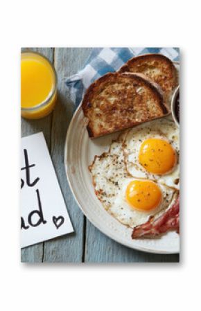 overhead view of a fathers day breakfast with a hand drawn card on table