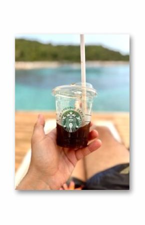 CONDADO, PUERTO RICO - JANUARY 24, 2017: A Starbucks coffee on the beach in Condado, Puerto Rico.