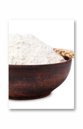 Wheat flour in bowl and spike on white background