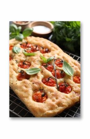 Delicious focaccia with tomatoes and spices on table, closeup