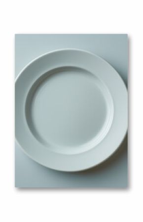 Highlighting food insecurity with an empty plate and utensils on a neutral background