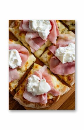 Pinsa romana with boiled ham and burrata cheese on wooden board, close-up
