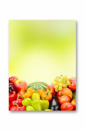Photo fresh various fruits, vegetables and berries on green background.