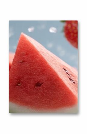 Juicy watermelons and strawberries hover with splashes of water, creating a lively display of freshness in bright, colorful detail
