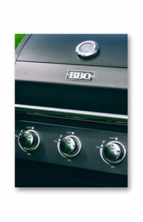 Barbecue gas grill in stainless steel. Black modern stainless portable BBQ barbecue grill outdoor.