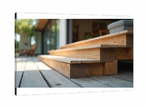 Wooden deck steps construction detail, featuring planks and support beams. Patio area with blurred interior background. Natural wood grain, building material for home improvement projects.