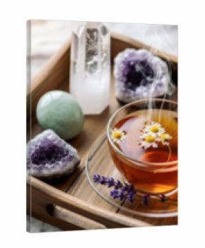calming spiritual ritual with chamomile tea and healing crystals