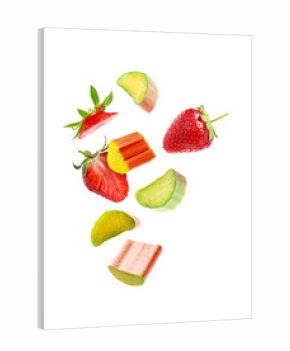 Fresh rhubarb pieces and strawberries flying in air against white background