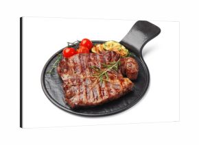 Delicious grilled beef steak with rosemary, zucchini and tomatoes isolated on white