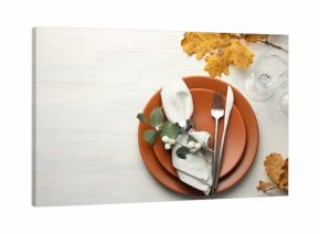 Beautiful table setting with autumn decor on white wooden background, flat lay. Space for text