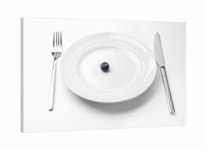 One blueberry on plate and cutlery on white table, closeup
