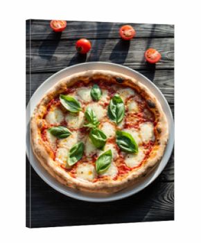 Margherita Pizza with Tomato and Basil on Black Surface