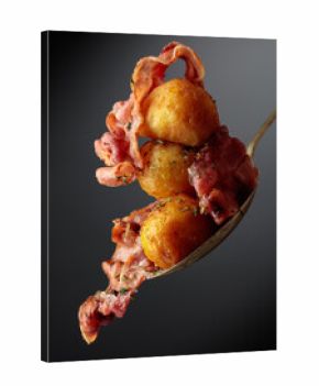 Roasted potatoes with bacon sprinkled with spices.