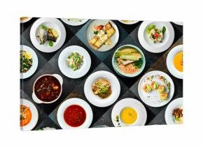 various different types of restaurant menu dishes in plates. Photo collage of food. Top view on black background.