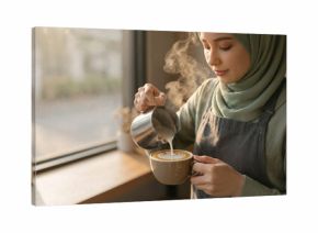 Malay barista pouring latte art in cafe