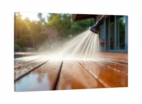 High pressure water jet cleans wooden deck surface. Spraying water on wet planks near pool. Outdoor home maintenance and cleaning with spray nozzle.