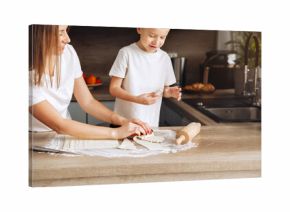Mother and child prepare dough in the kitchen during a morning baking session while enjoying time together