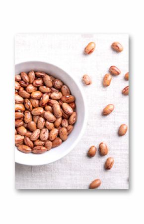 Cranberry beans, Borlotti beans in white bowl on linen. Tan colored, streaked with red variety of the common bean Phaseolus vulgaris, also known as Borlotto, Roman, saluggia, gadhra or rosecoco bean.