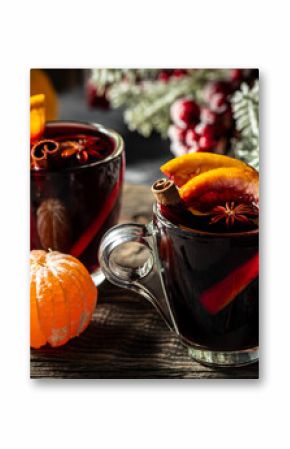 Christmas mulled wine with spices and oranges, festive cocktail