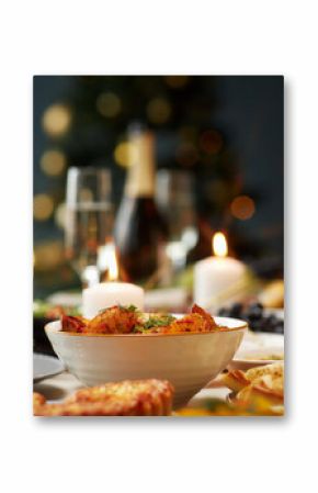 Background shot of baked potato wedges as side dish and champagne glass with sparkling drink served on festive dining table on Christmas Eve, copy space