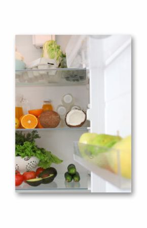 Different fresh products in fridge in kitchen. Closeup