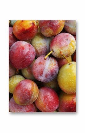 Tasty ripe plums on table, flat lay