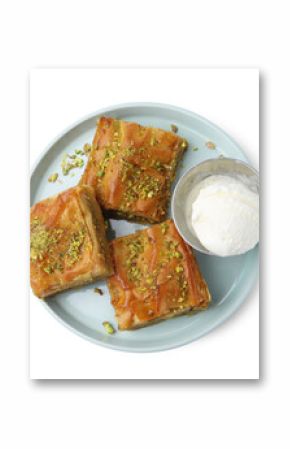 Delicious baklava with crushed nuts and ice cream isolated on white, top view