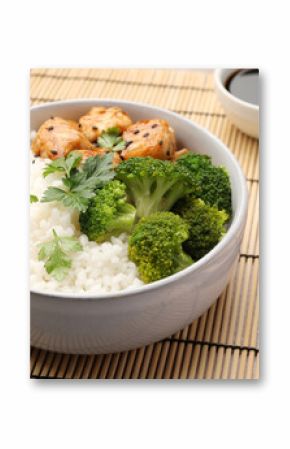 Tasty rice with broccoli and chicken served on table, closeup